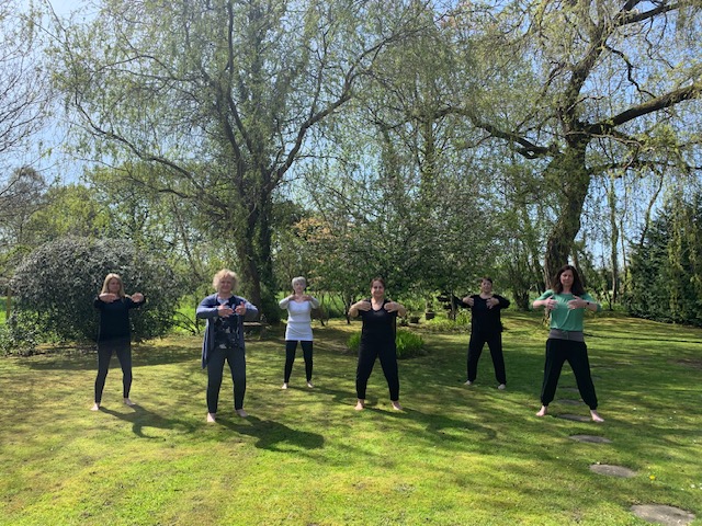 Students Practising Qi Gong Classes in Guildford in peaceful garden